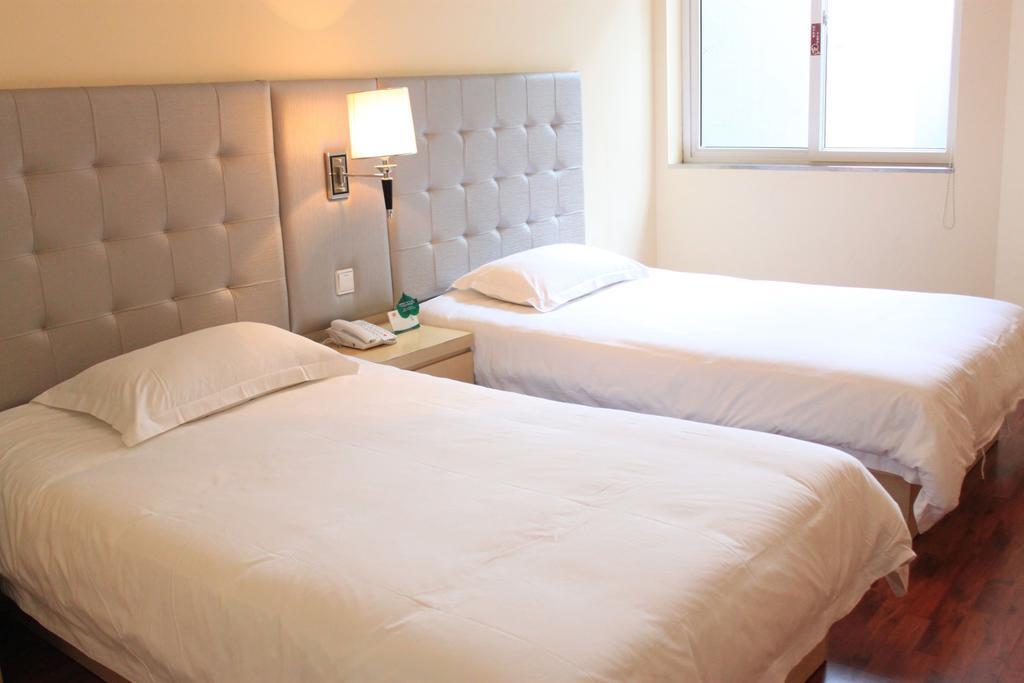 Qingdao Renjia Bussiness Hotel Værelse billede